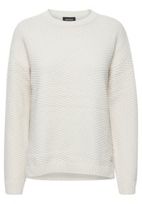 Pull beige clair avec un motif texturé, des poignets et un ourlet côtelés. Présente une coupe ample et un col rond. Étiquette de marque visible à l'intérieur.
