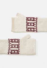 Guanti senza dita in maglia crema con motivo geometrico bordeaux e polsini a costine. Texture morbida, progettati per il calore e la facilità di movimento.