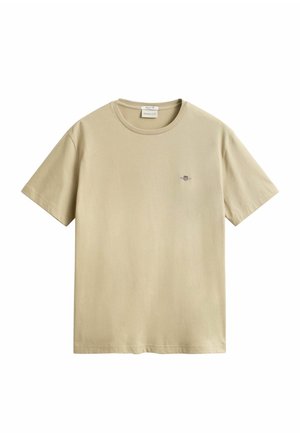 T-shirt beige à manches courtes avec col rond et petit logo brodé sur la poitrine gauche de la marque GANT.