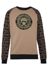 Felpa beige a maniche lunghe con maniche a motivo nero, caratterizzata da un logo di un leone in rilievo dorato al centro e un bordo a costine nero.