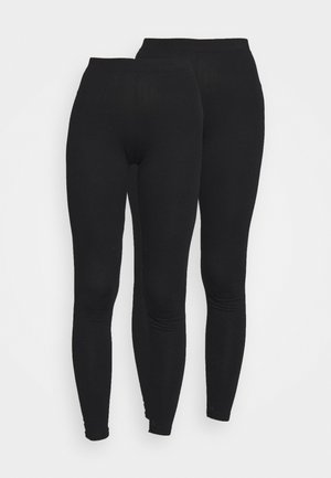 Leggings noirs avec une taille élastique, fabriqués dans un tissu lisse et extensible. Présentent un design ajusté se rétrécissant aux chevilles.