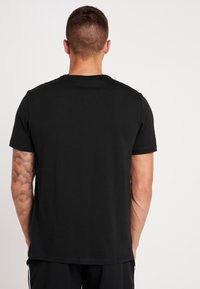 Champion Camiseta estampada - black