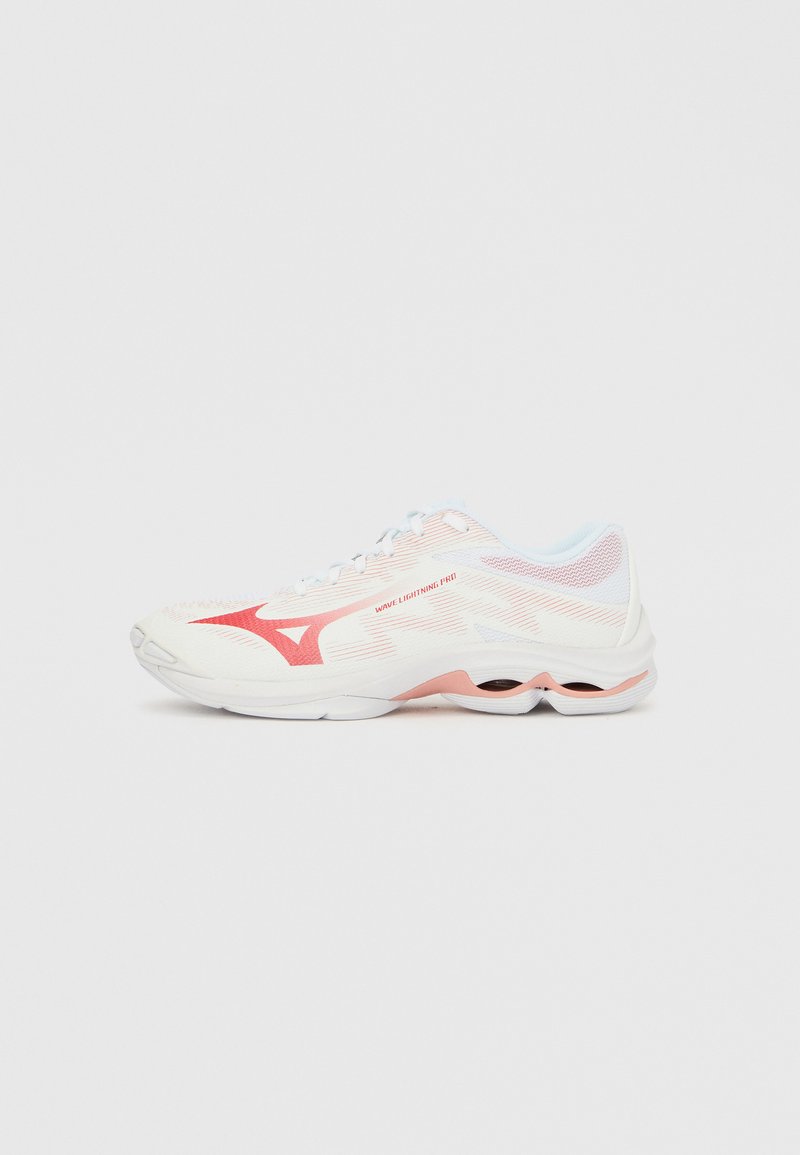 White athletic shoes with pink accents, mesh upper, streamlined design, cushioned sole, and distinctive feature of visible air pockets.