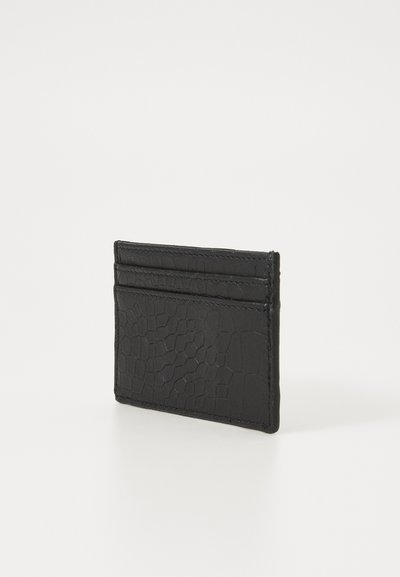 Black card holder made of textured leather, featuring a reptile pattern, with three card slots on the front and a sleek design.