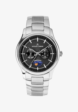 Sølvmetal armbåndsur med sort tekstureret urskive, datovisning og ugedagsundervisere, månefasevisning og mærkenavnet "Jacques Lemans."