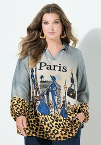 Silke skjorte med et gradient teal-design, Paris-tryk i blå og guld, med en leopardmønstret kant og to sidelommer.