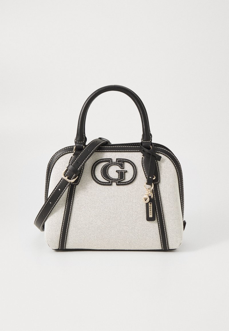 Beige handbag with black leather accents, double handles, and an adjustable strap. Features a prominent logo and contrasting stitching for detail.