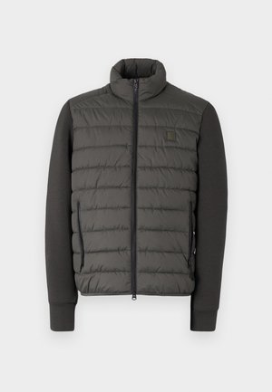 Puffer jacket with a high collar, dark gray padded front, and matching sleeves. Features zippered side pockets and a logo patch.