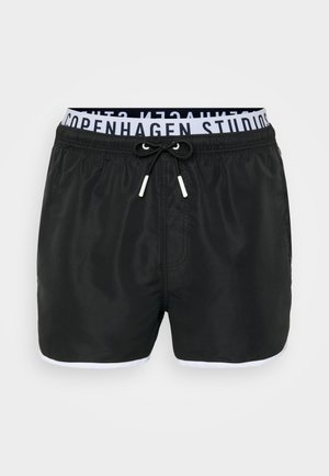 Juodos maudymosi šortai su balta apdaila ir raišteliu. Yra plati elastinė juosmens juosta, užrašytu "Copenhagen Studios" juoda spalva. Glotni tekstūra.