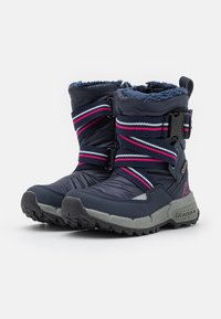 Dark navy waterproof boots with pink and white striped straps, textured rubber sole, fur-lined collar, and adjustable buckle.