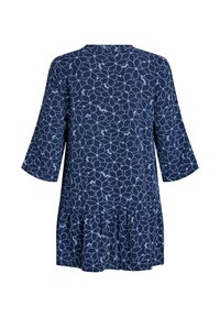 Navy blue tunic dress with a floral pattern in light blue. Features three-quarter sleeves and a ruffled hem at the bottom. Soft material.