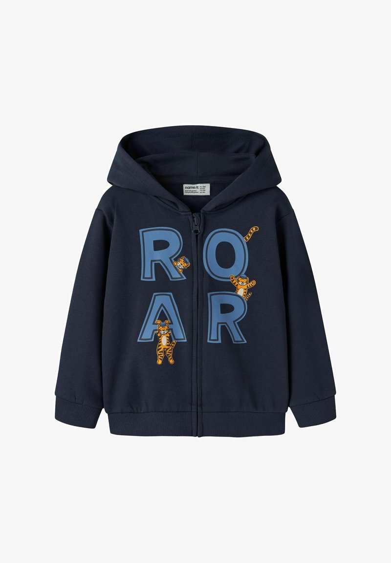 Sudadera con cremallera en navy hecha de una mezcla de algodón, con grandes letras azules que dicen "ROAR" e ilustraciones de tigres juguetones en el frente. Presenta una capucha y puños acanalados.