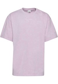 Light purple short-sleeve t-shirt made of soft fabric, featuring a small white logo on the chest. Casual, loose fit. Simple design.