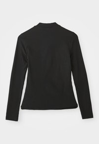Black long-sleeve top made of soft fabric, featuring a simple crew neckline and a fitted design with no visible logos or patterns.