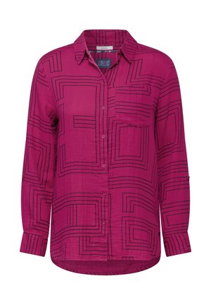 Chemise fuchsia à manches longues et à boutons avec une poche, dotée d'un motif géométrique en lignes noires et d'une coupe décontractée. Tissu doux et léger.