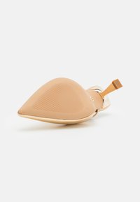 ALDO TAWM - Mules à talons - gold