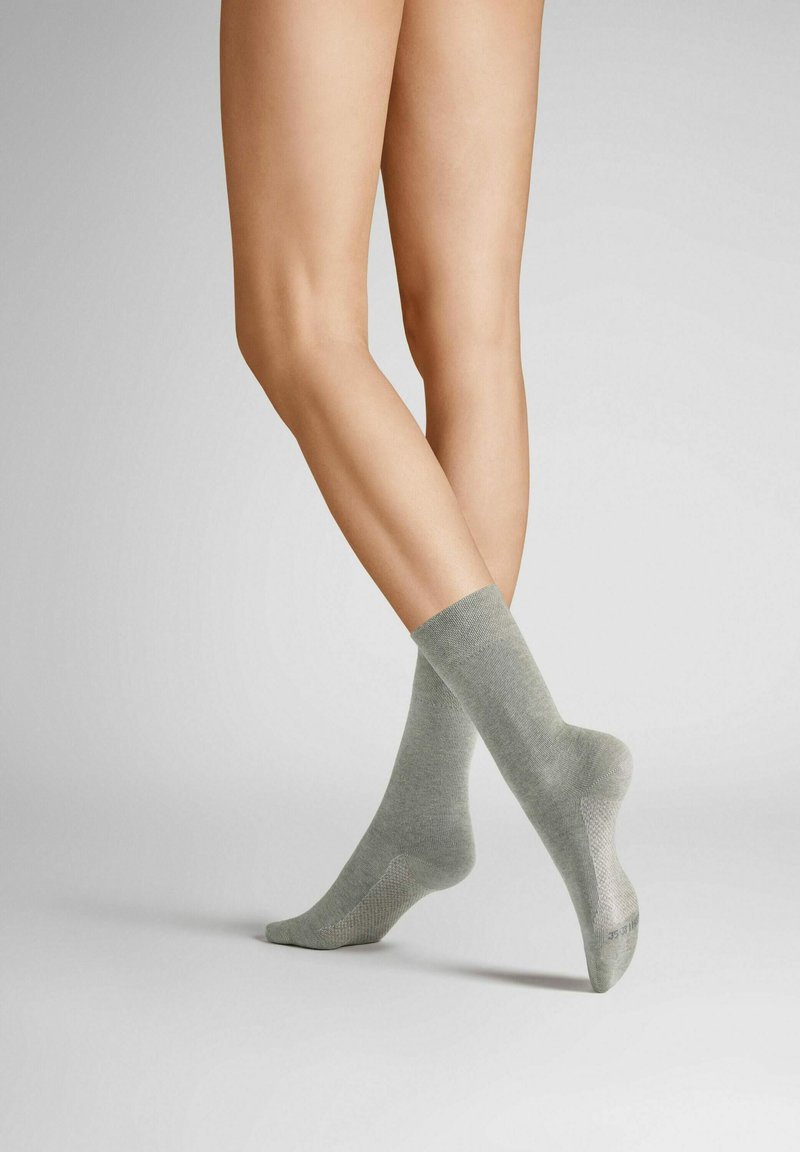 Gray socks made from a soft material, featuring a ribbed design and a smooth texture, with a slightly contrasting heel and toe.