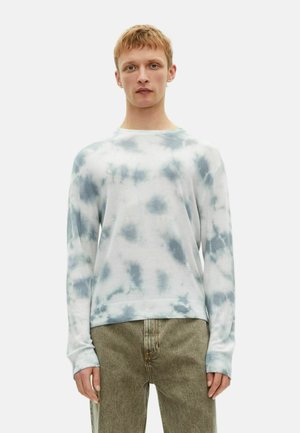 Langsleeve tie-dye sweatshirt in wit en lichtblauw, zachte stof, relaxte pasvorm, ronde halslijn, ribgebreide manchetten en tailleband.