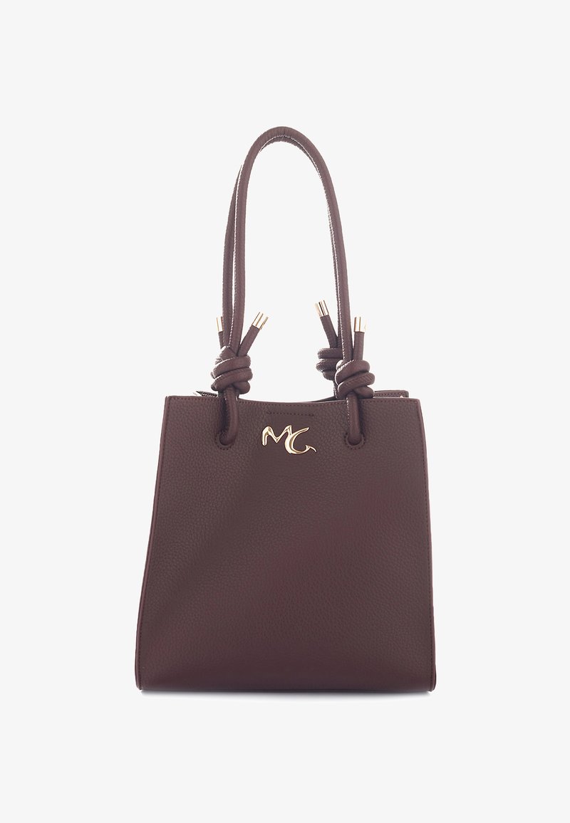 Borsa a tracolla in pelle marrone con logo dorato "MC", manici doppi annodati con punte dorate e superficie texture.