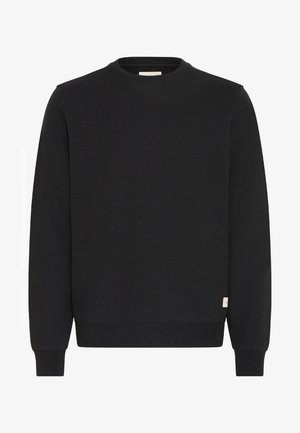 Lihtne must ümar kaelusega sviiter, millel on pikad varrukad ja ribakudumisest mansetid ning allosas väike valge silt paremal.