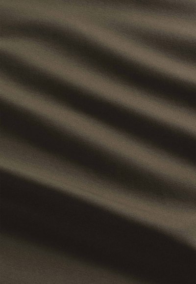 Dark green fabric with a smooth texture, featuring subtle ripples and variations in shade, emphasizing its soft, luxurious appearance.