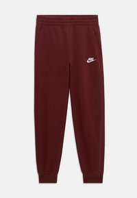 Burgundske Nike trenirke s elastičnim pojasom, bočnim džepovima i bijelim logotipom na lijevom bedru. Glatka tkanina i suženi gležnjevi.