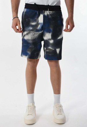 Pantaloni corti blu e neri con un motivo, superficie testurizzata, vita elasticizzata e cordoncino. Contiene accenti di testo bianchi.