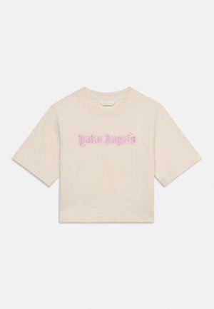 Beige cropped T-shirt met korte mouwen en roze gestileerde tekst "Palm Angels" in het midden van de borst.