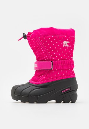 Roze waterdichte winterlaars met witte stippen, zwarte rubberen zool, verstelbare bovenkant en klittenbandsluiting met het Sorel-logo.