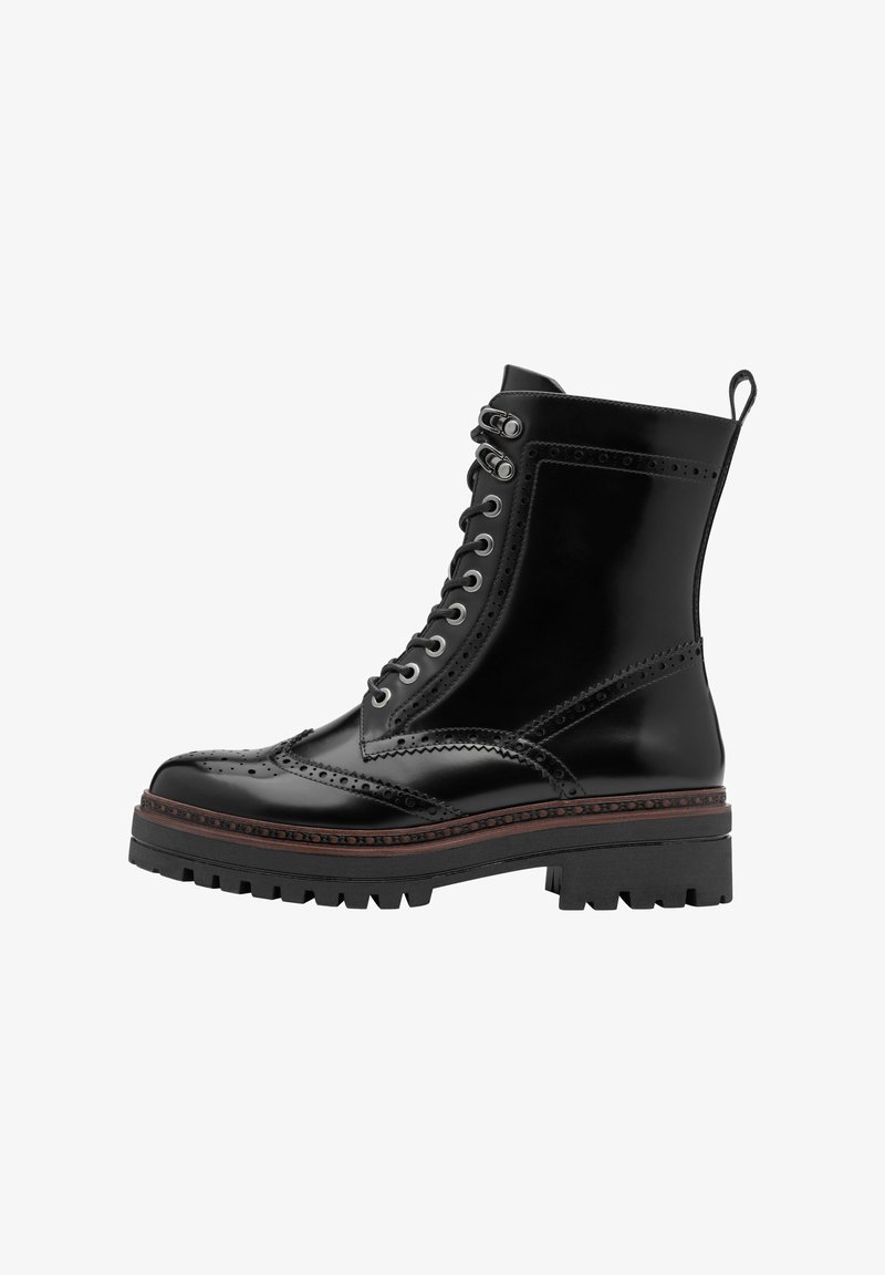 Black leather ankle boot with a brogue design, laced front, chunky sole, and decorative stitching. Features a pull tab at the back.
