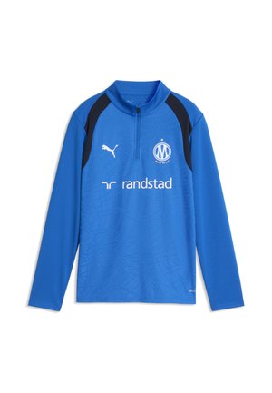Niebieska sportowa koszulka z długim rękawem i czarnymi panelami na ramionach, logo Puma, godłem Olympique de Marseille oraz logo sponsora Randstad na przodzie.