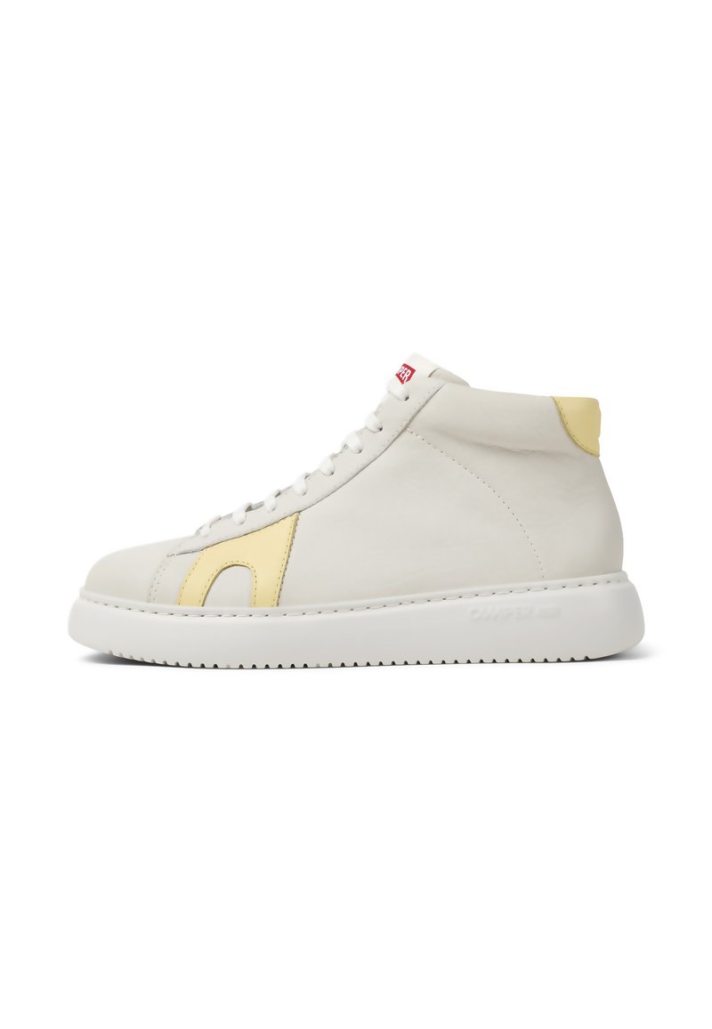 High-top sneakers made of white leather with a yellow accent, flat white sole, and red logo tag. Features smooth texture and minimal design.