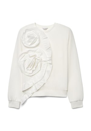 Sweat-shirt blanc à manches longues avec deux grandes rosaces en tissu et un volant décoratif sur le côté gauche devant.