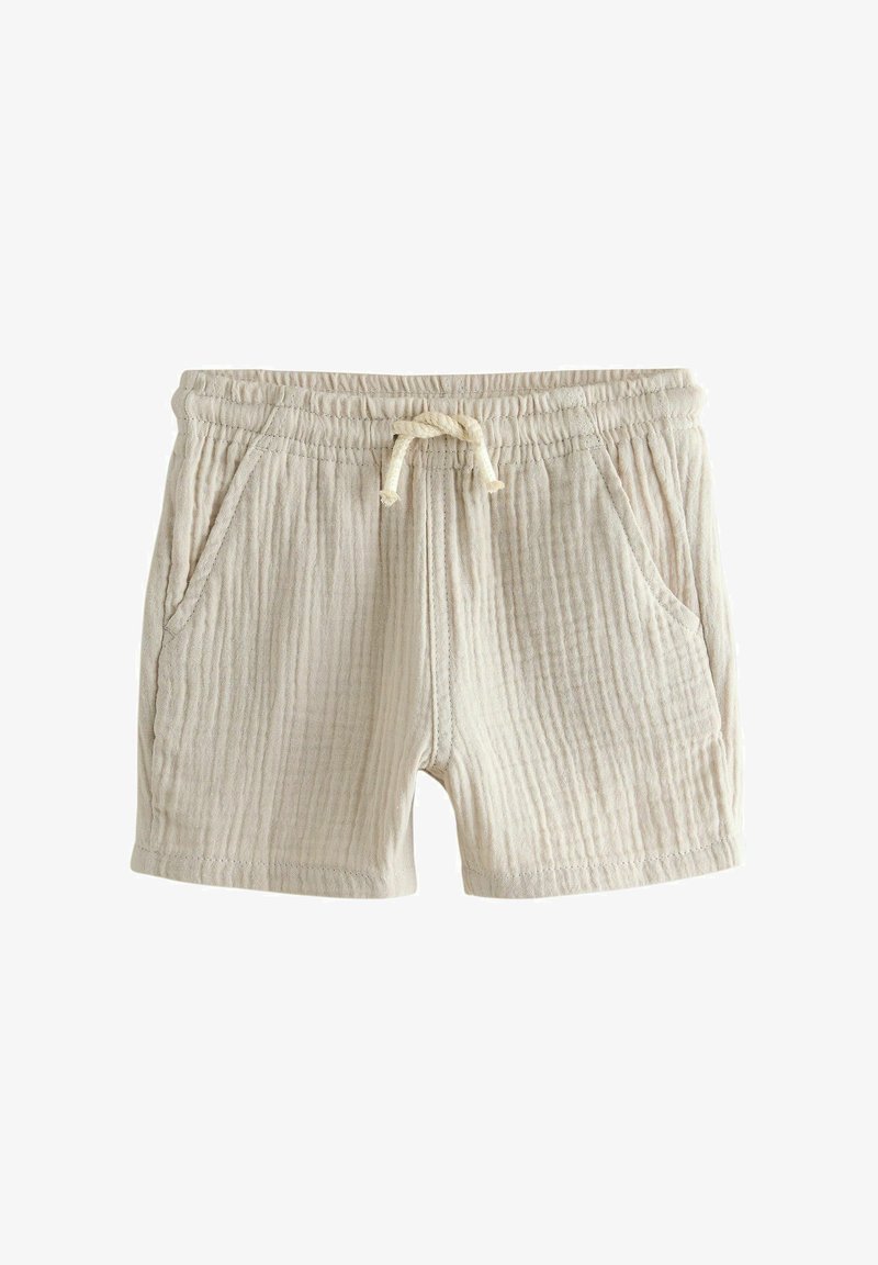 Shorts beige jusqu'au genou en tissu texturé, dotés d'une ceinture élastique avec cordon de serrage et de deux poches latérales.