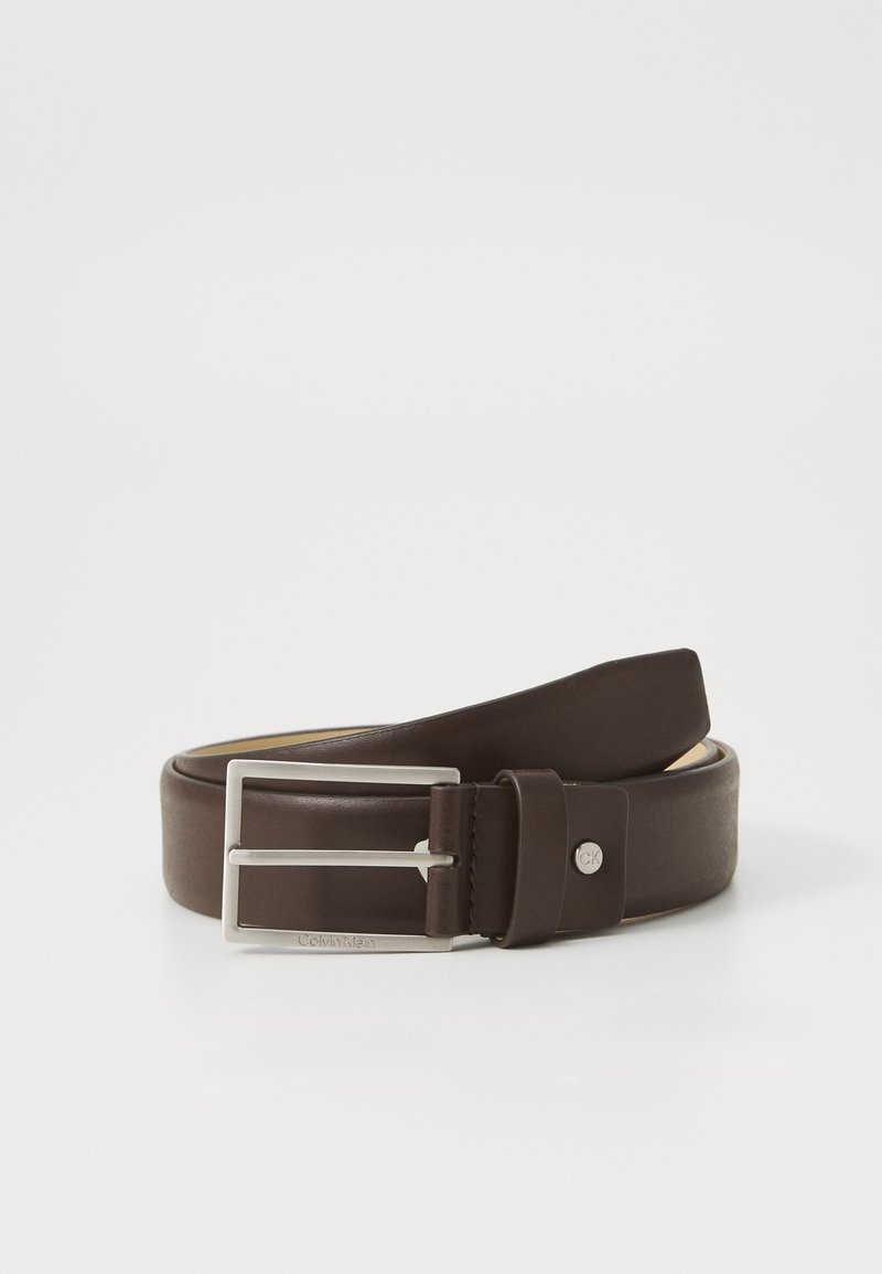 Brown leather belt with a smooth texture, silver metal buckle, and logo detail. Features a classic design with a flat, rounded end.