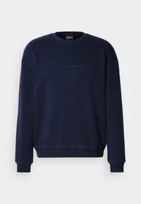Navy blue sweatshirt with a crew neck, ribbed cuffs, and hem. Features subtle logo text on the front and soft, textured fabric.