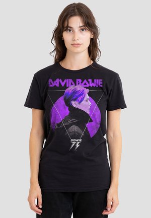 Black cotton t-shirt featuring a graphic of David Bowie's profile in purple, with "DAVID BOWIE" text and geometric triangle details.