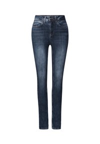 Jean skinny en denim bleu foncé. Caractérisé par une coupe ajustée, un design standard à cinq poches et des coutures contrastantes le long des seams.