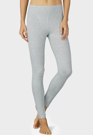 Leggings grigio chiaro realizzati in morbido tessuto elasticizzato, con un design aderente e senza cuciture visibili, dotati di un elastico in vita e lunghezza alla caviglia.