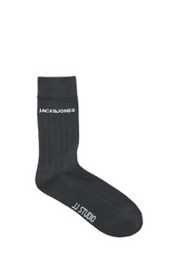 Zwarte geribbelde sok met witte "JACK&JONES" en "JJ STUDIO" tekstlogo's. Heeft een standaard lengte voor crew-sokken en een soepele textuur.