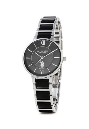 Silver and black watch with a round face, Roman numerals, and a logo. Features a stainless steel and black enamel band for a sleek design.