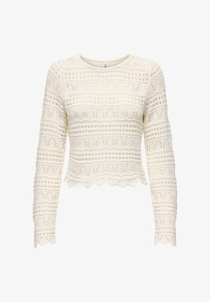 Kreminės spalvos, ilgomis rankovėmis trumpintas megztinis su atviru mezgimu, kuriame yra horizontalių ir vertikalių raštų, su banguota apačia.