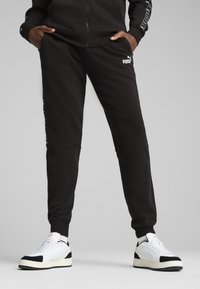 Puma - ESSENTIALS TAPE  - Tracksuit bottoms - black Thumbnail Image 1