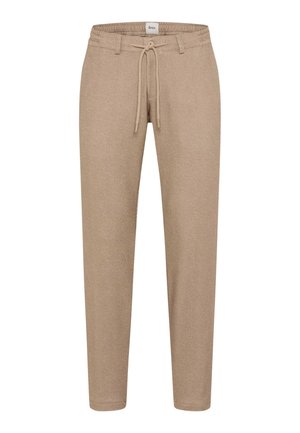 Beige tapschoenen gemaakt van gestructureerde stof met een elastische tailleband en verstelbaar trekkoord, zonder zichtbare zakken.