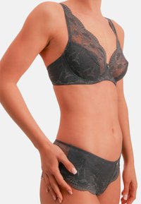 Dark gray lace bra and matching panties with floral patterns, soft mesh texture, and scalloped edges, providing a delicate and feminine appearance.