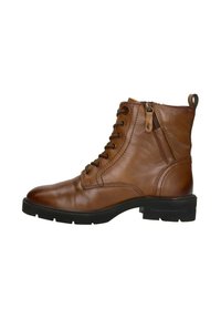 Bruine leren enkelboots met een vetersluiting aan de voorkant, een rits aan de zijkant, een ronde neus en een gestructureerde zool. Stikdetails accentueren de gladde afwerking.