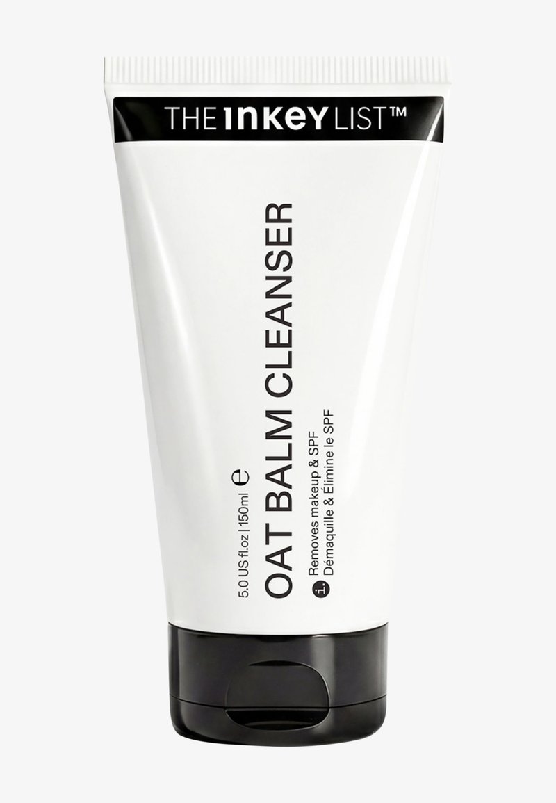 Weiße Tube von The Inkey List Oat Balm Cleanser, 150 ml, mit schwarzem Klappverschluss und Text, der angibt, dass es Make-up und SPF entfernt.