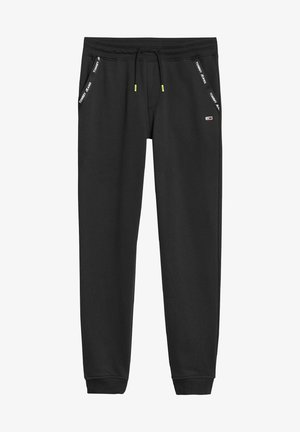 Pantalones deportivos negros hechos de tela suave con una cintura elástica y cordón ajustable. Detalles destacados incluyen el logotipo de la marca en los laterales.