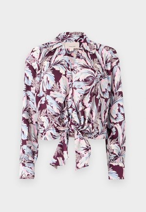 Blouse met lange mouwen, knoopsluiting en een bloemenpatroon in roze, blauw en wit op donkerpaars, met een knoop aan de voorkant en een kraag.
