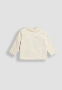 Gai beige garo piedurkņu krekls no mīksta, teksturēta auduma ar apaļu kaklu un divām spiedpogu pogām uz pleca, lai vieglāk tērptos.